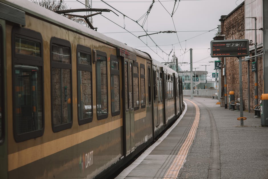Dublin DART train on a station platform, showcasing urban transportation.